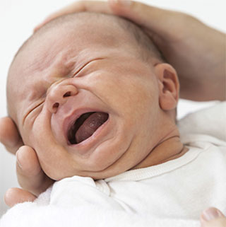 A photo of a baby with colic